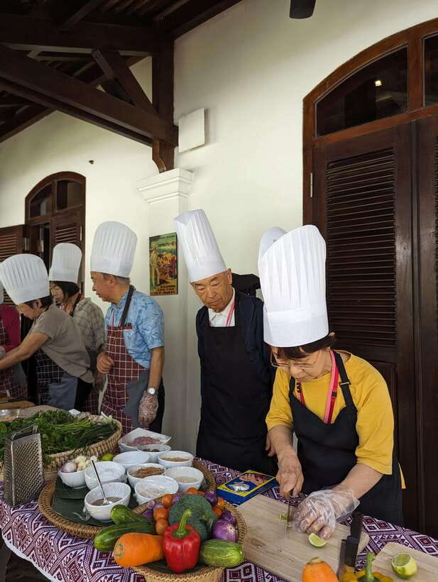 Luang Prabang: Cooking Class at the Former Royal Palace - Cooking Lao dishes with a small group