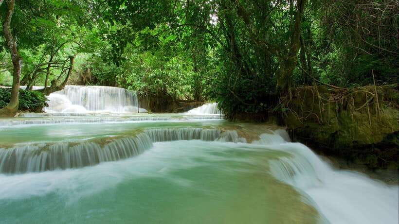 Luang Prabang: Kuang Si Bike Ride & Long-Tail Boat Cruise - Riding the paved road beside the Mekong