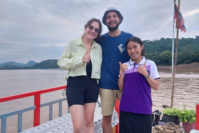 Luang Prabang Mekong Sunset Cruise and Hot Pot Dinner - Boarding the slow boat behind the Royal Palace