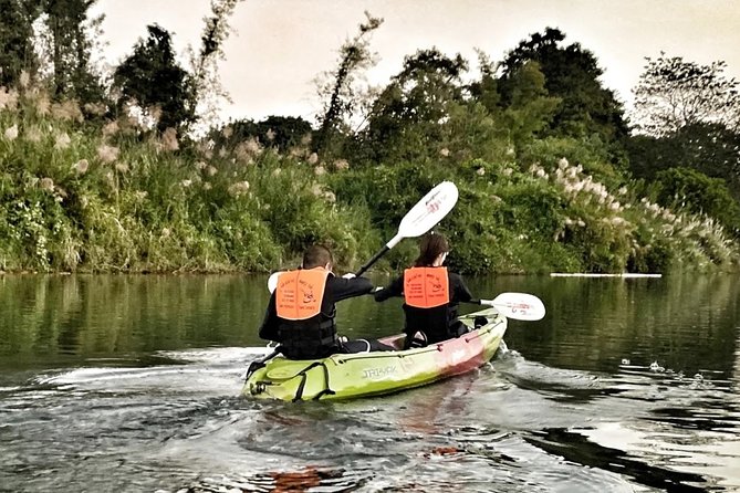 One Day Guided Tour: Kayaking, Zipline & Tubing In The Cave from Vang Vieng - Tubing between the river stations