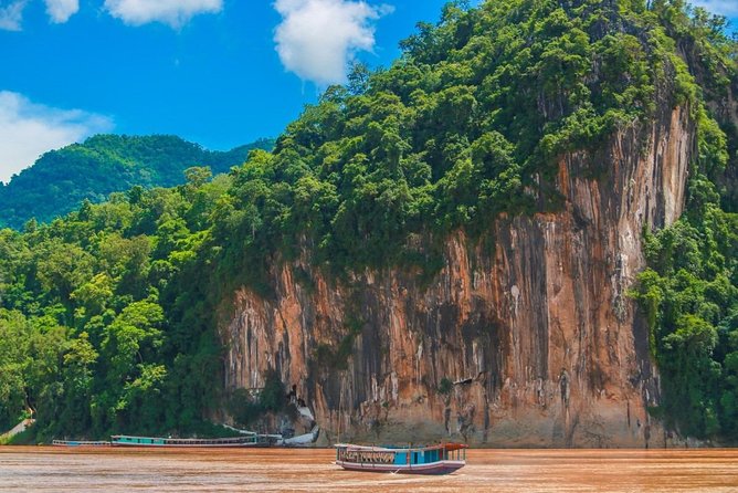 Pak Ou Caves and Kuang Si Fall Day Tour - A village stop that adds local context