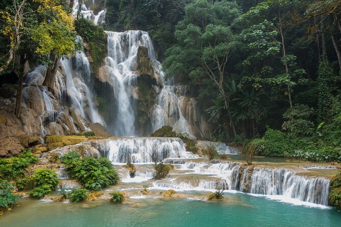 Private Tour: Pak Ou Cave and Kuang Si Waterfall Tour from Luang Prabang - Pak Ou Caves, Buddha figures, and a cliffside shrine